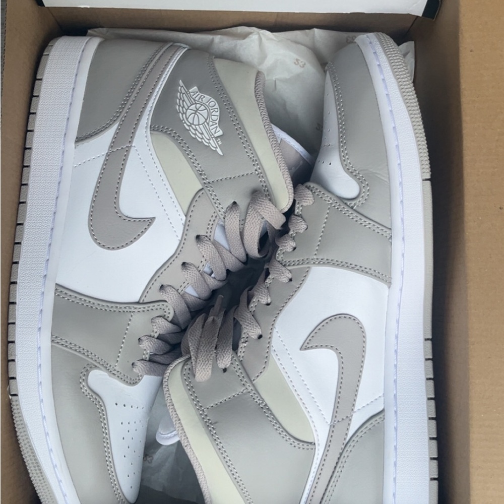 Nike Gray and White Sneakers with Classic High-Top Design
